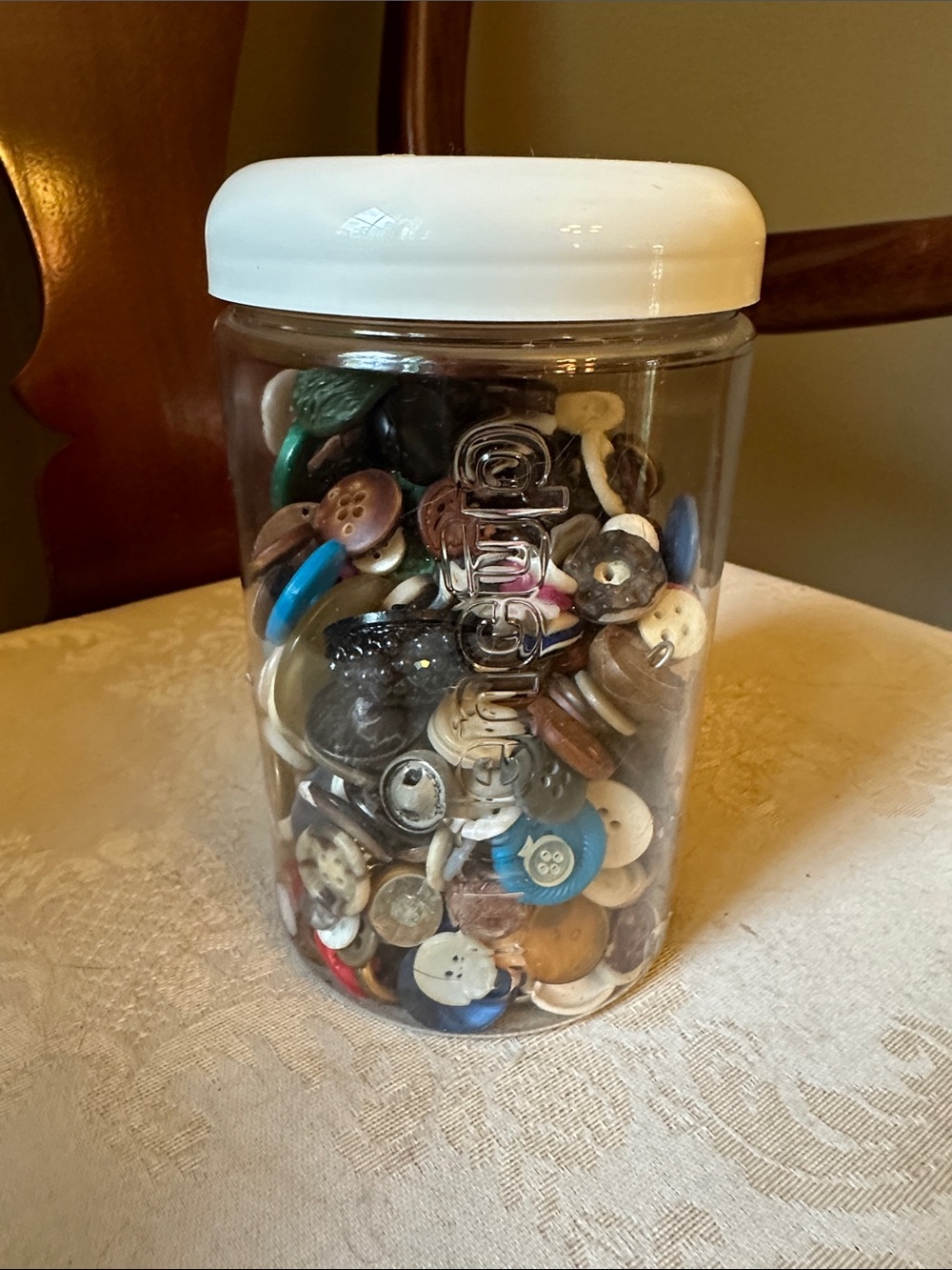 Jar full of vintage buttons dating back to 1950s, a little bit of everything
